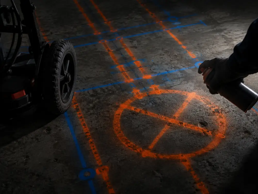 Rebar and conduit locations spray-painted on a slab after a GPR scan